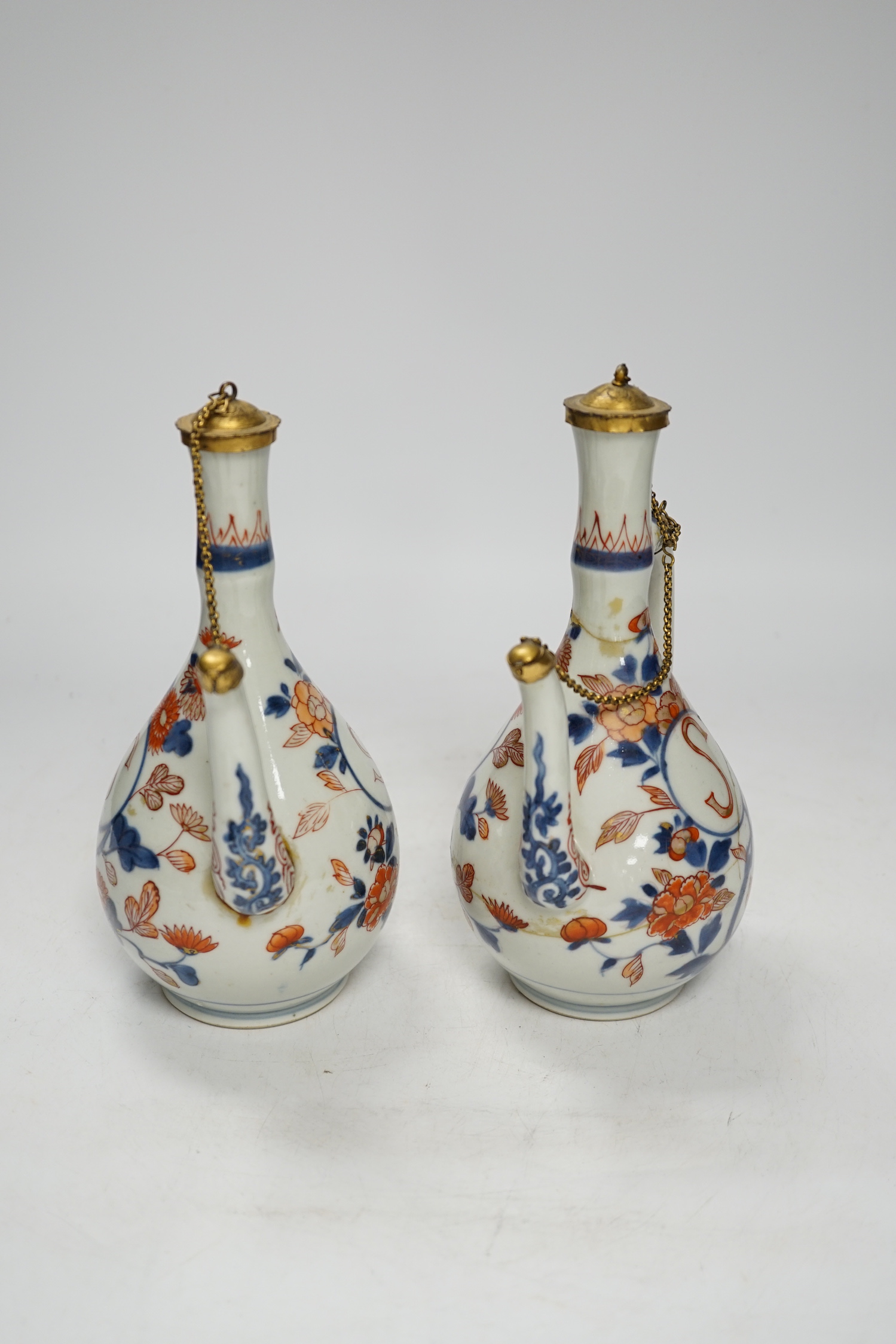 A pair of late 17th/early 18th century Japanese Arita Imari ewers, European gilt metal mounts, a/f, 20cm